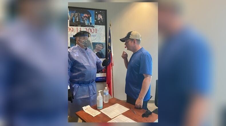 Smyrna Mayor Derek Norton volunteer to take a less-invasive, self-administered COVID-19 test. The tests will be available at no charge to city employees July 28-30.