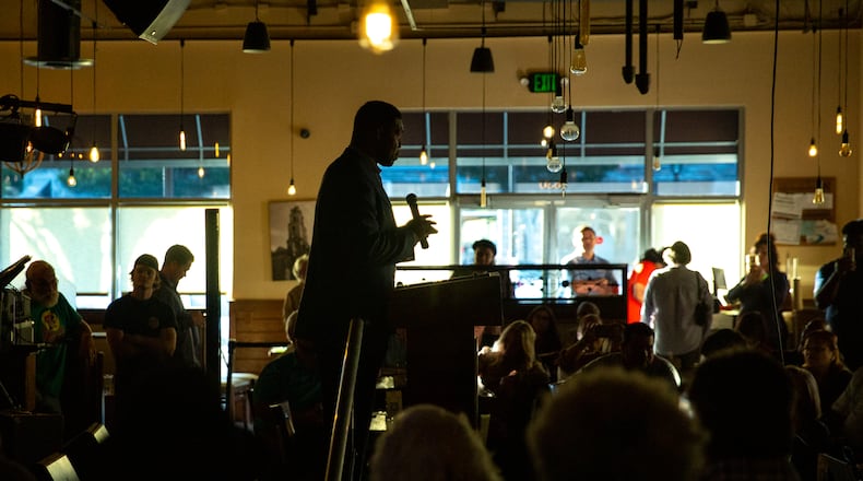 Herschel Walker campaigns at Mojitos Bistro in Norcross on Monday, September 26, 2022  in his bid for congress with support from Utah Congressman Burgess Owens, Florida Congressman Byron Donalds and Walker's wife, Julie Blanchard, ahead of the November elections.  (Jenni Girtman for The Atlanta Journal-Constitution)
