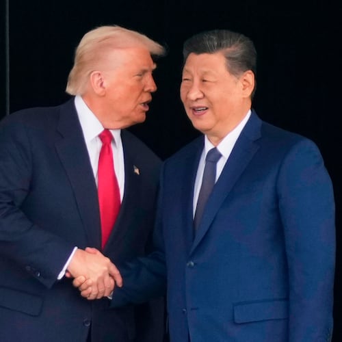 FILE - President Donald Trump, left, and Chinese President Xi Jinping, shake hands after their U.S.-China summit talk at Gimhae International Airport Jinping in Busan, South Korea, Oct. 30, 2025. (AP Photo/Mark Schiefelbein, File)