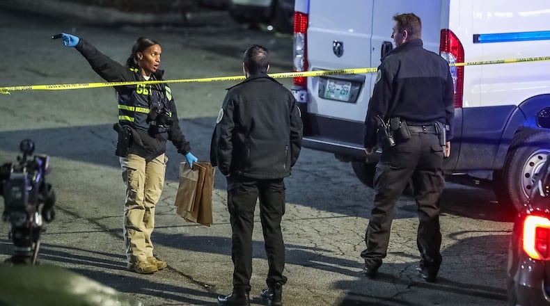 Norcross police and GBI agents investigated the deadly shooting Jan. 9 at the HomeTowne Studios Atlanta on Jimmy Carter Boulevard. (John Spink / John.Spink@ajc.com)