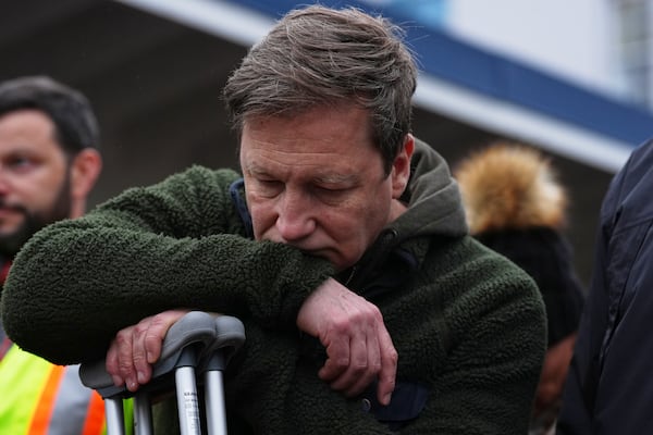 Noel Johansen, whose wife Jenifer Darbellay died after a vehicle drove into a crowd during a Filipino heritage festival, reacts at a vigil outside Sir Alexander Mackenzie Elementary School in Vancouver, British Columbia, Monday, April 28, 2025. (AP Photo/Lindsey Wasson)