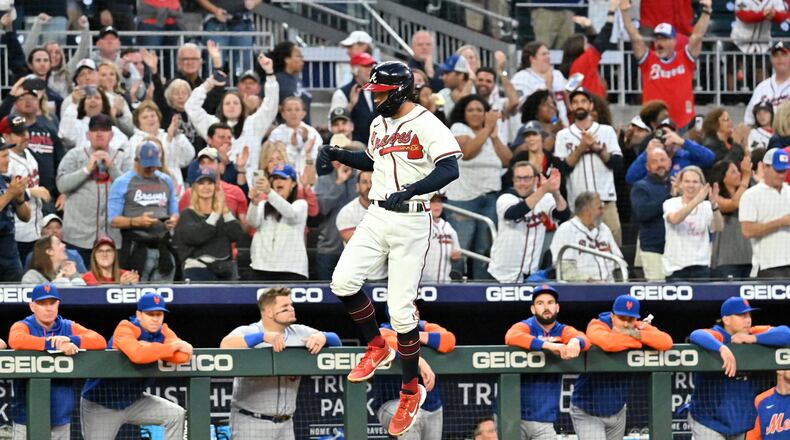 Braves' shortstop Dansby Swanson (7) celebrates after hitting a solo home run in the first inning at Truist Park on Sunday, October 2, 2022. (Hyosub Shin / Hyosub.Shin@ajc.com)