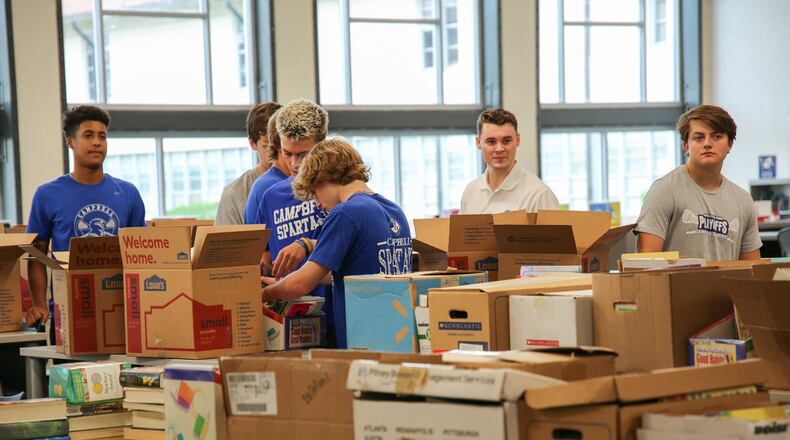 Campbell High School seniors collected about 3,000 books to start two libraries in Africa.