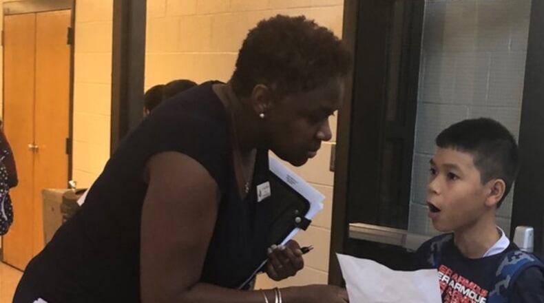 Tereka Williams, principal at Shiloh Middle Schools has a brief discussion with one of her students. Williams recently graduated from Gwinnett County Public School’s Aspiring Principal Program.