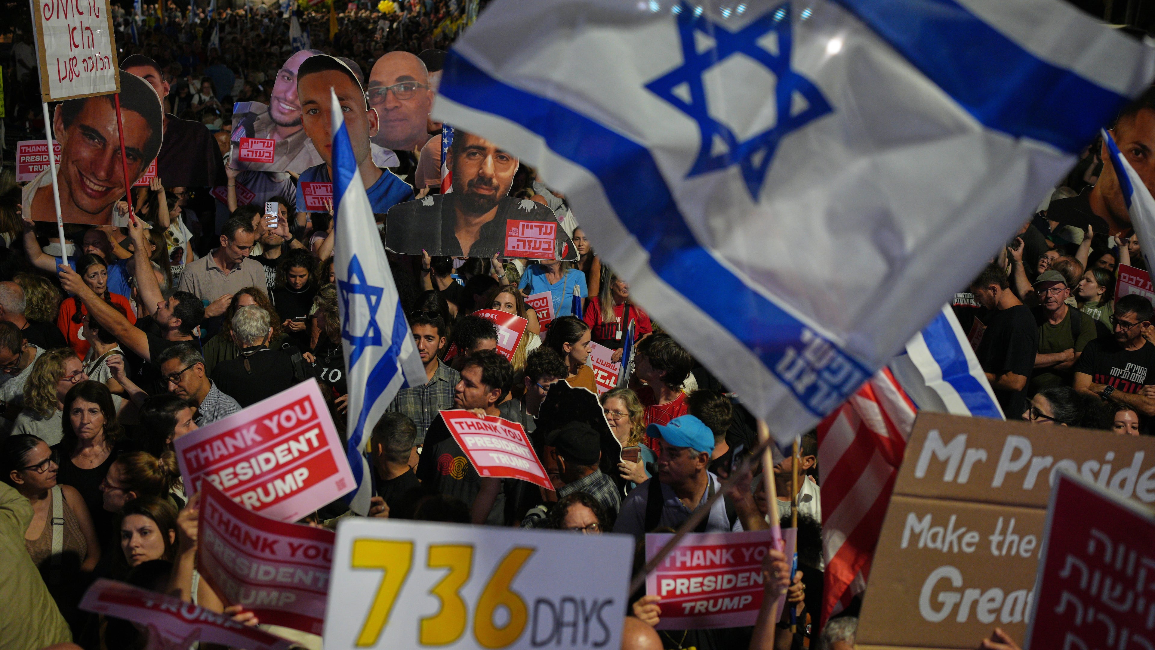 People take part in a rally in support of hostages kidnapped by Hamas, at a plaza known as hostages square, in Tel Aviv, Israel, Saturday, Oct. 11, 2025, ahead of the expected release of the hostages held in the Gaza Strip. (AP Photo/Emilio Morenatti)