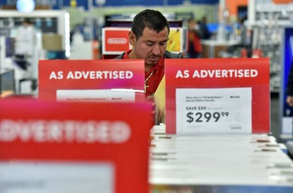 Eden Villafuerto looks Black Friday sale items inside Best Buy in Duluth on Friday, November 25, 2016. HYOSUB SHIN / HSHIN@AJC.COM