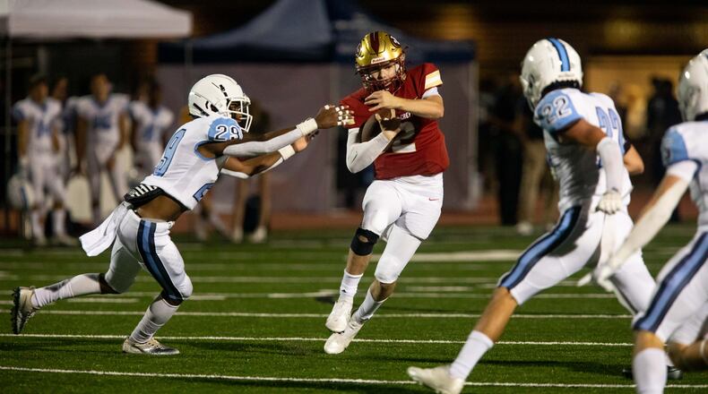 Johns Creek quarterback Kyle Durham (2) runs the ball during a GHSA high school football game between Cambridge High School and Johns Creek High School in Johns Creek, Ga. on Friday, October 15, 2021. (Photo/Jenn Finch)