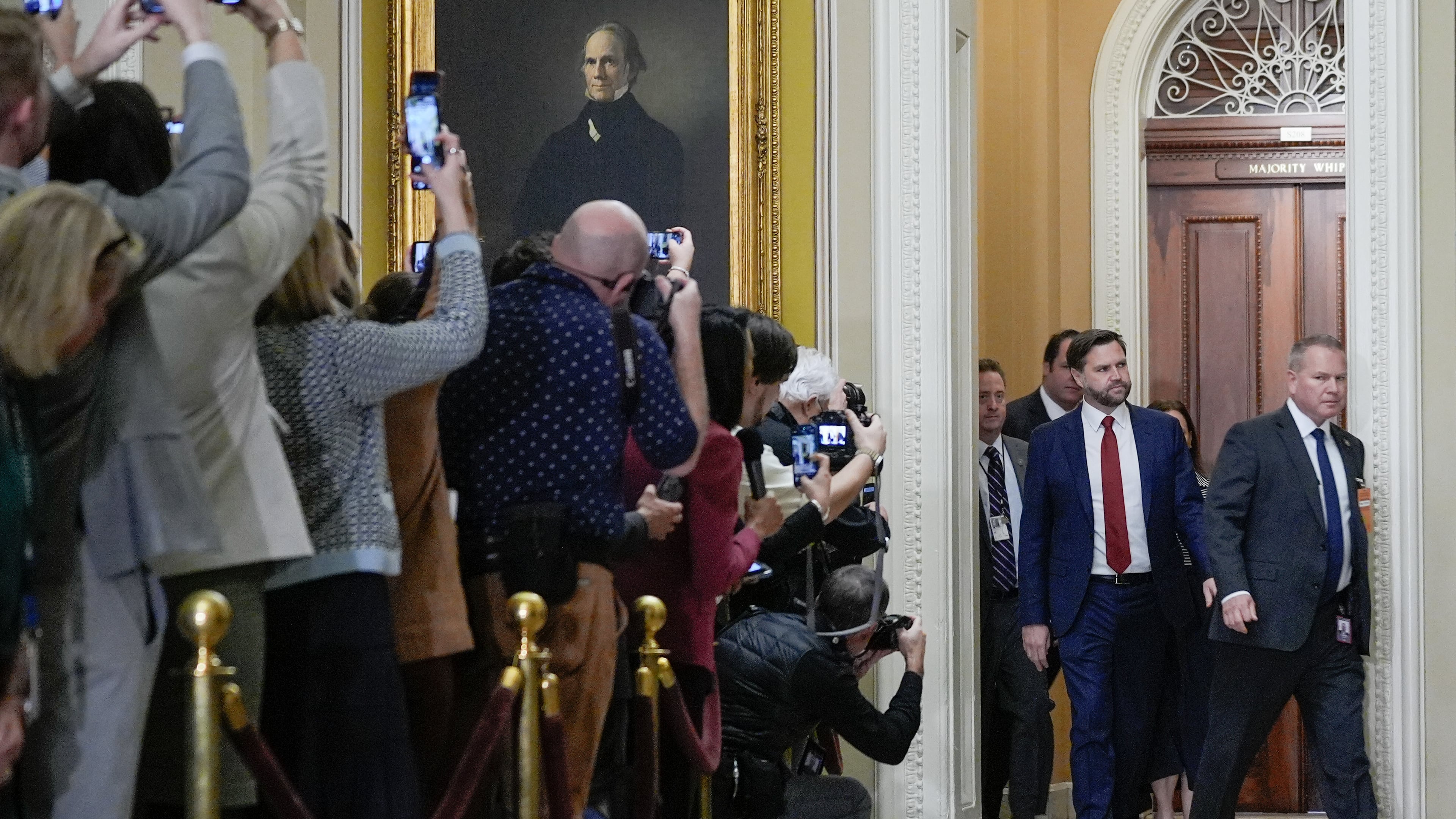 Vice President JD Vance, center, arrives for a Senate Republican Conference luncheon at the U.S. Capitol on day 28 of the government shutdown, Tuesday, Oct. 28, 2025, in Washington. (AP Photo/Mariam Zuhaib)