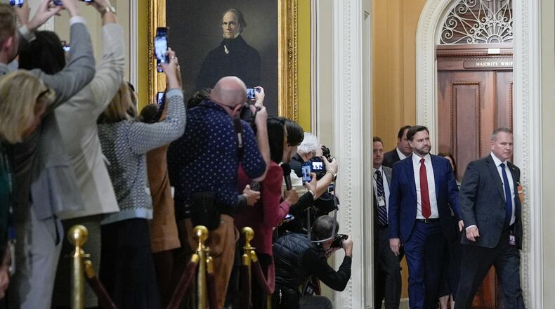 Vice President JD Vance, center, arrives for a Senate Republican Conference luncheon at the U.S. Capitol on day 28 of the government shutdown, Tuesday, Oct. 28, 2025, in Washington. (AP Photo/Mariam Zuhaib)