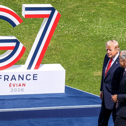 U.S. President Donald Trump, left, speaks with Canadian Prime Minister Mark Carney prior to a group photo of G7 leaders and invited nations during the G7 summit in Evian-les-Bains, France, Tuesday, June 16, 2026. (Dominique Jacovides, Pool Photo via AP)