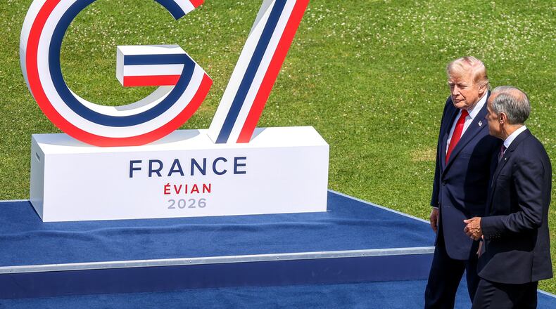 U.S. President Donald Trump, left, speaks with Canadian Prime Minister Mark Carney prior to a group photo of G7 leaders and invited nations during the G7 summit in Evian-les-Bains, France, Tuesday, June 16, 2026. (Dominique Jacovides, Pool Photo via AP)