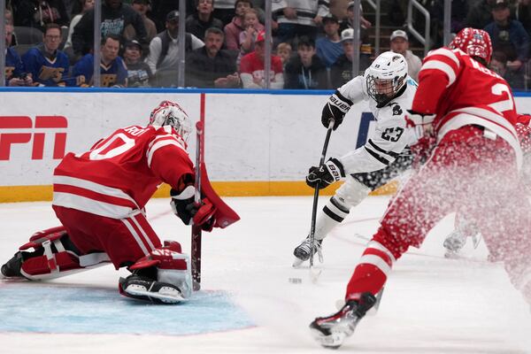 Western Michigan's Liam Valente (23) tries to get off a shot as Boston University goaltender Mikhail Yegorov defends during the first period in the championship game of the NCAA Frozen Four men's college hockey tournament, Saturday, April 12, 2025, in St. Louis (AP Photo/Jeff Roberson)
