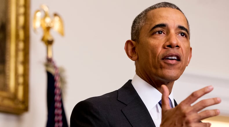 FILE - In this Jan. 17, 2016 file photo, President Barack Obama speaks about the release of Americans by Iran, in the Cabinet Room of the White House in Washington. A $400 million cash delivery to Iran to repay a decades-old arbitration claim may be unprecedented in recent U.S. history, according to legal experts and diplomatic historians, raising further questions about a payment timed to help free four American prisoners in Iran. (AP Photo/Jacquelyn Martin, File)