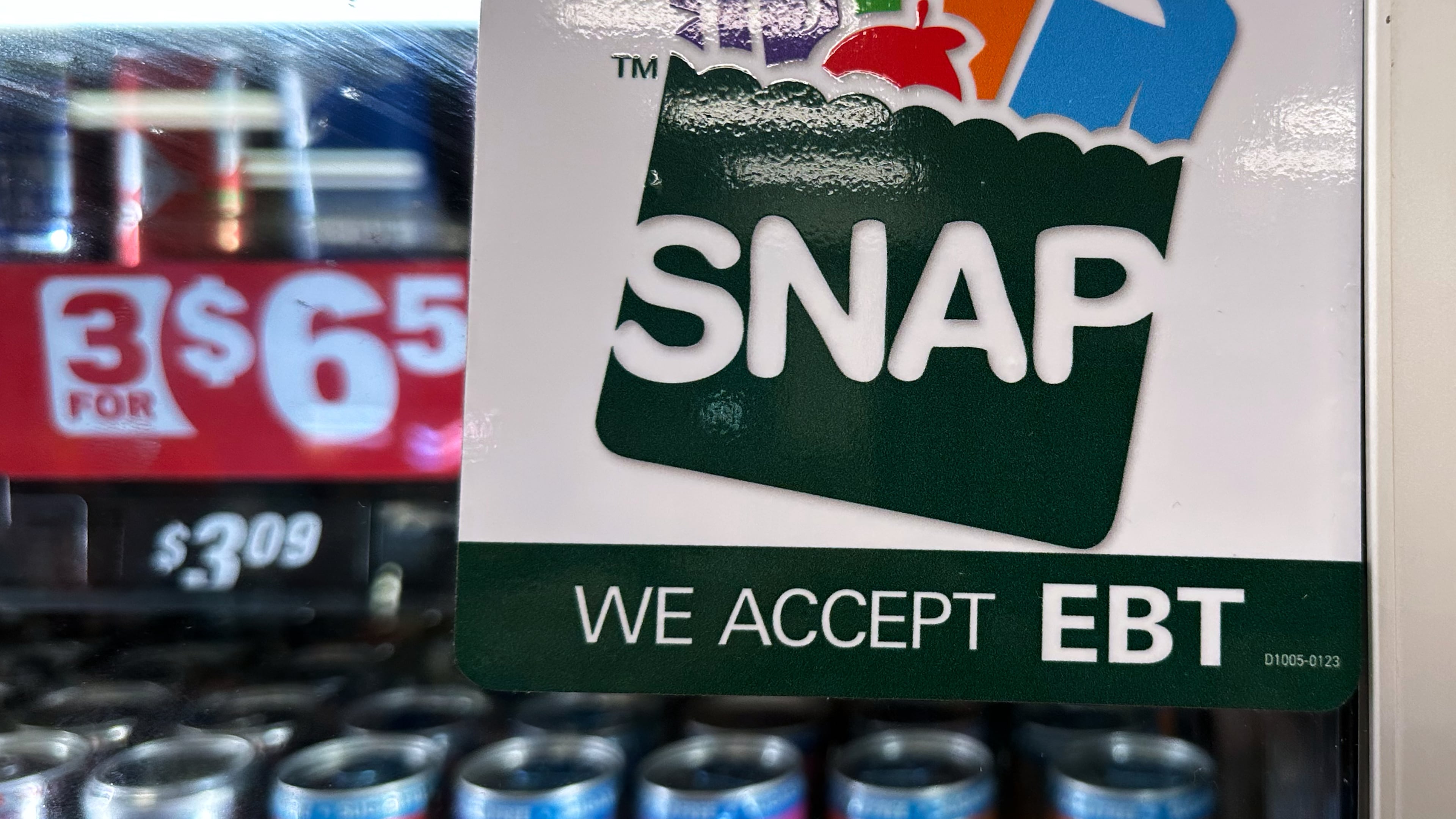 FILE - SNAP EBT information sign is displayed at a gas station in Riverwoods, Ill., Saturday, Nov. 1, 2025. (AP Photo/Nam Y. Huh, file)