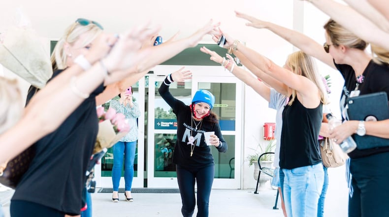 Margie Singleton celebrates with the women who make up Margie’s Army after completing her last chemotherapy treatment. CONTRIBUTED BY LACIE NICOLE WIGGINS / SOUTHERN LENS PHOTOGRAPHY