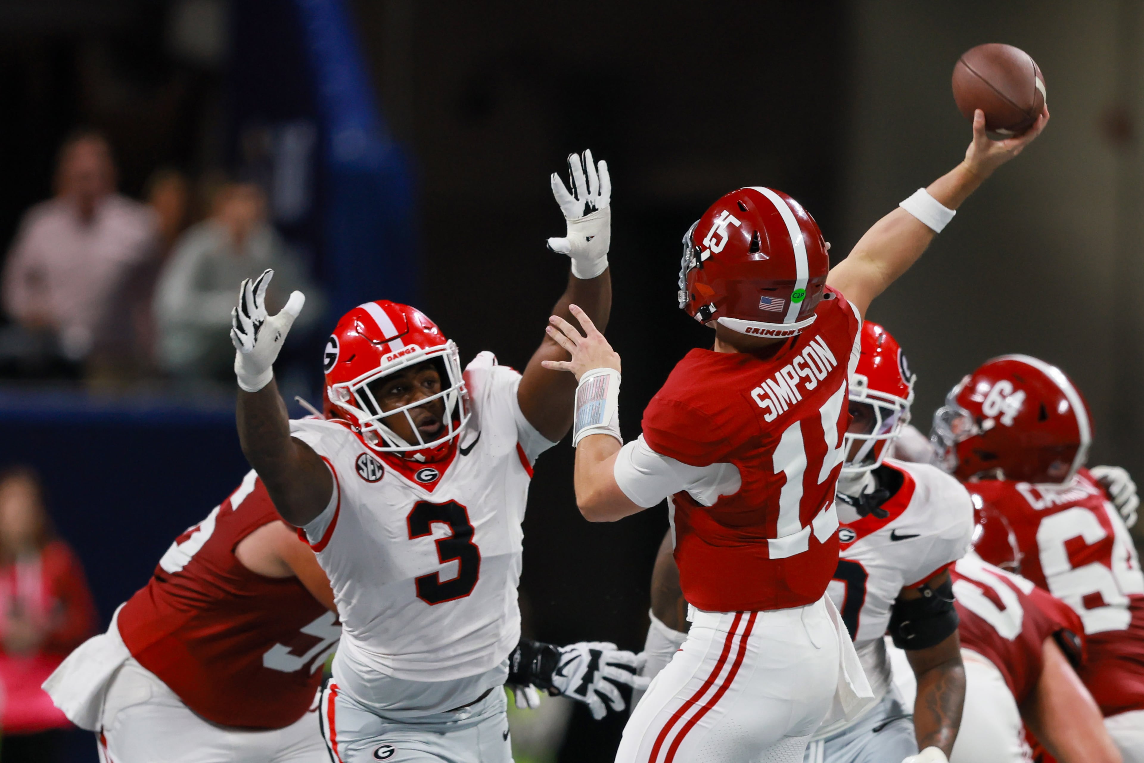 Alabama quarterback Ty Simpson (15) is pressured by Georgia linebacker CJ Allen (3) during the fourth quarter of the SEC Championship game at Mercedes-Benz Stadium, Saturday, Dec. 6, 2025, in Atlanta. (Jason Getz / AJC)