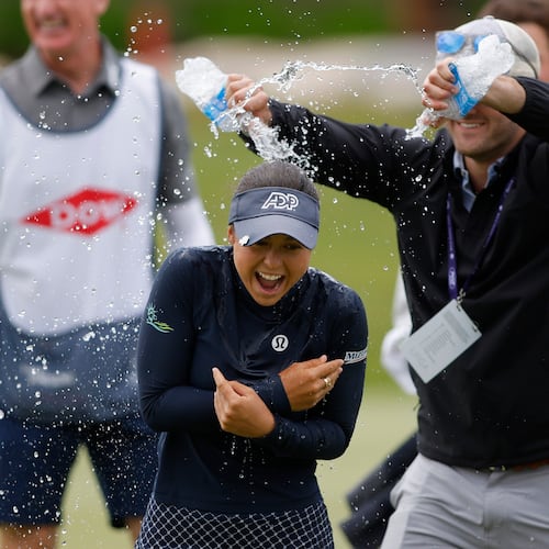 Yana Wilson, center, is doused on the 18th hole after winning the Dow Championship LPGA golf tournament, Sunday, June 14, 2026, at Midland Country Club in Midland, Mich. (AP Photo/Al Goldis)