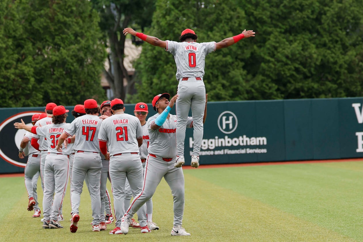 Georgia Bulldog players gather in the outfiled moments before they face the Mississippi State Bulldogs for Game 2 of the NCAA Super Regional at Foley Field on Sunday, June 7, 2026, in Athens. (Miguel Martinez/AJC)