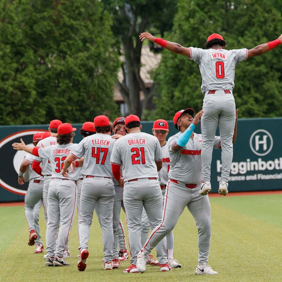 Georgia Bulldog players gather in the outfield moments before they face the Mississippi State Bulldogs for Game 2 of the NCAA Super Regional at Foley Field on Sunday, June 7, 2026, in Athens. (Miguel Martinez/AJC)