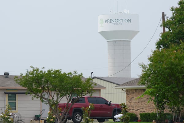 A water tower bears the name of the town, Princeton, Texas, Friday, May 16, 2025. (AP Photo/LM Otero)