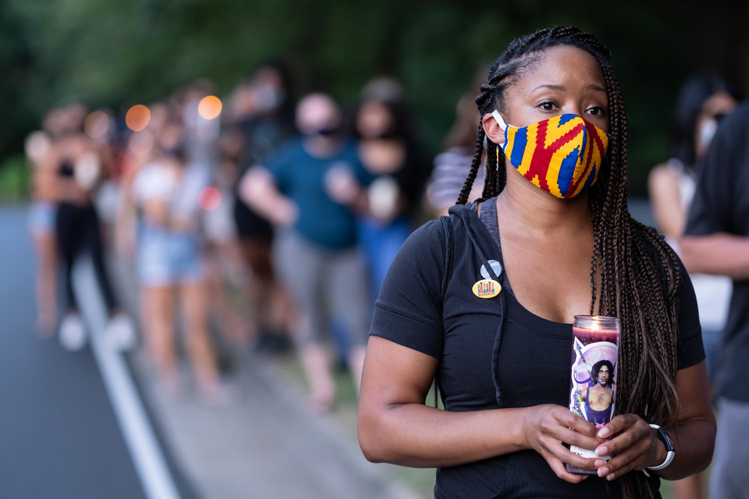 Mary Pope stands on John Lewis Freedom Parkway during a candlelight vigil and march in honor of the late U.S. Rep. John Lewis on Sunday, July 19, 2020. (Photo: Ben Gray for The Atlanta Journal-Constitution)