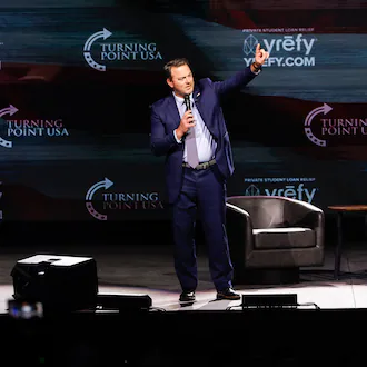 Lt. Gov. Burt Jones speaks at a Turning Point USA event that featured Vice President JD Vance at Akins Ford Arena in Athens on Tuesday, April 14, 2026. (Arvin Temkar/AJC)