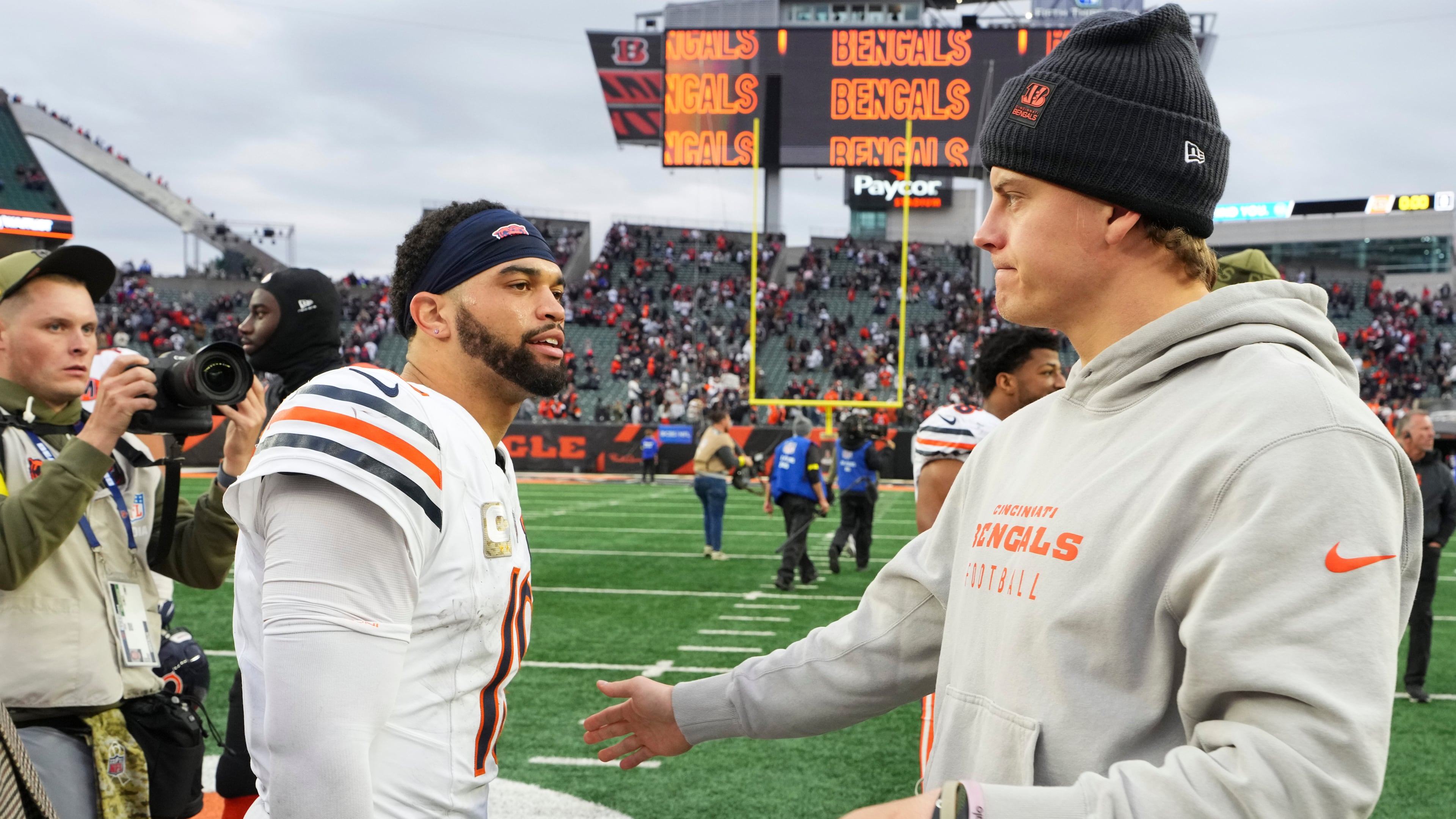 Cincinnati Bengals quarterback Joe Burrow (9), right, greets Chicago Bears quarterback Caleb Williams (18) after an NFL football game, Sunday, Nov. 2, 2025, in Cincinnati. (AP Photo/Jeff Dean)