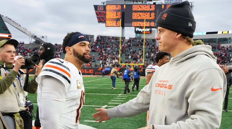 Cincinnati Bengals quarterback Joe Burrow (9), right, greets Chicago Bears quarterback Caleb Williams (18) after an NFL football game, Sunday, Nov. 2, 2025, in Cincinnati. (AP Photo/Jeff Dean)