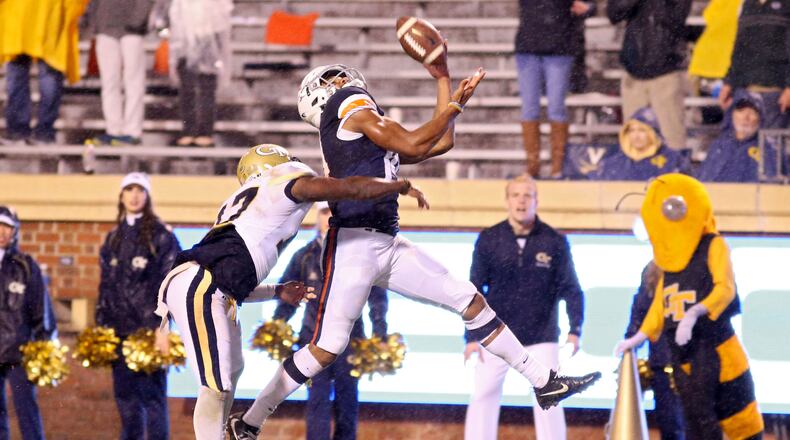 Virginia's Andre Levrone catches would was the winning touchdown pass over Georgia Tech's Lance Austin late in the fourth quarter Saturday. (Ryan M. Kelly/Getty Images)