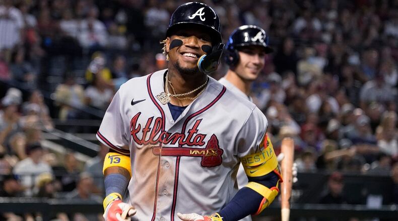 Atlanta Braves' Ronald Acuña Jr. smiles after his solo home run against the Arizona Diamondbacks during the sixth inning of a baseball game Saturday, June 3, 2023, in Phoenix. (AP Photo/Darryl Webb)