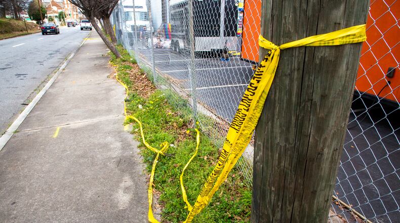 Police tape is still visible on Central Avenue Southwest in Atlanta on Sunday, March 6, 2022, a day after a triple shooting left a teenager dead and two others injured. (Photo by Steve Schaefer for The Atlanta Journal-Constitution)