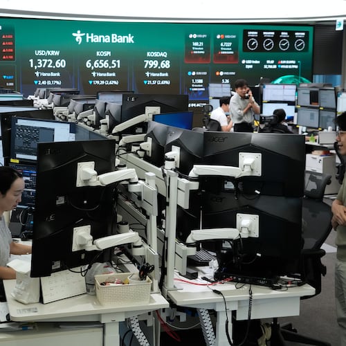 Currency traders work at the foreign exchange dealing room of the Hana Bank headquarters in Seoul, South Korea, Wednesday, Sept. 2, 2026. (AP Photo/Ahn Young-joon)