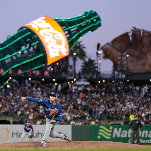 Los Angeles Dodgers pitcher Shohei Ohtani throws to a San Francisco Giants batter during the fifth inning of a baseball game Wednesday, April 22, 2026, in San Francisco. (AP Photo/Tony Avelar)