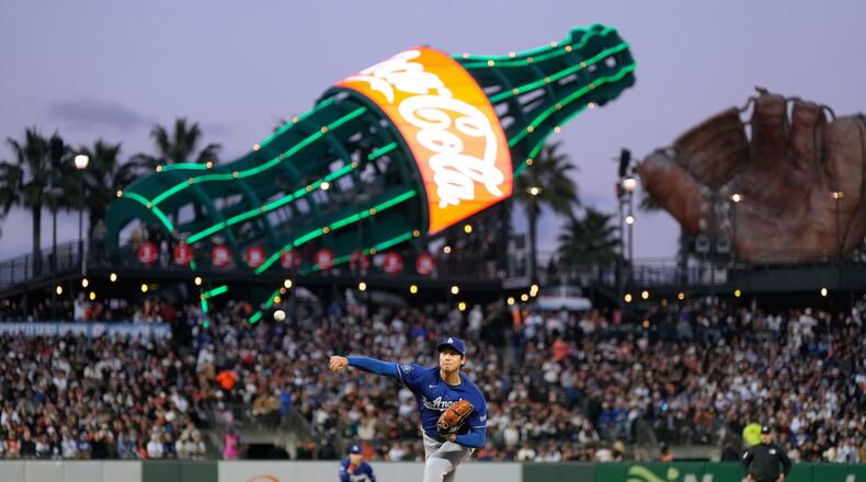 Los Angeles Dodgers pitcher Shohei Ohtani throws to a San Francisco Giants batter during the fifth inning of a baseball game Wednesday, April 22, 2026, in San Francisco. (AP Photo/Tony Avelar)