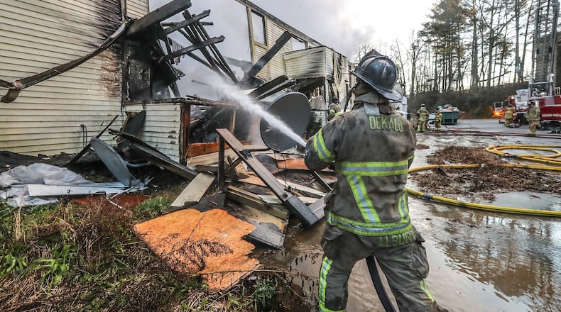 A fire destroyed several units at a DeKalb County condo complex Monday morning. (John Spink / john.spink@ajc.com)