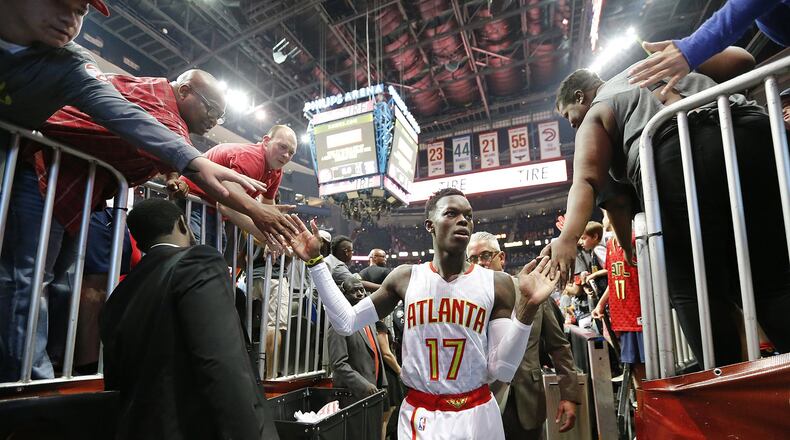Hawks’ Dennis Schroder celebrates a 116-98 victory over the Wizards with fans in Game 3 of a first-round NBA basketball playoff series on Saturday, April 22, 2017, in Atlanta. Curtis Compton/ccompton@ajc.com
