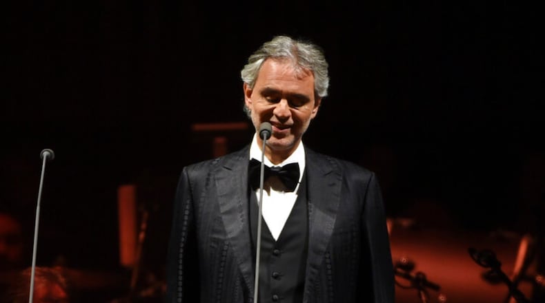 FILE - This Dec. 15, 2016 file photo shows tenor Andrea Bocelli performing with The Philharmonic of New York at Madison Square Garden in New York. Bocelli will give a solo livestreamed performance on Easter Sunday from the main historic cathedral in Milan, Italy. (Photo by Evan Agostini, File)