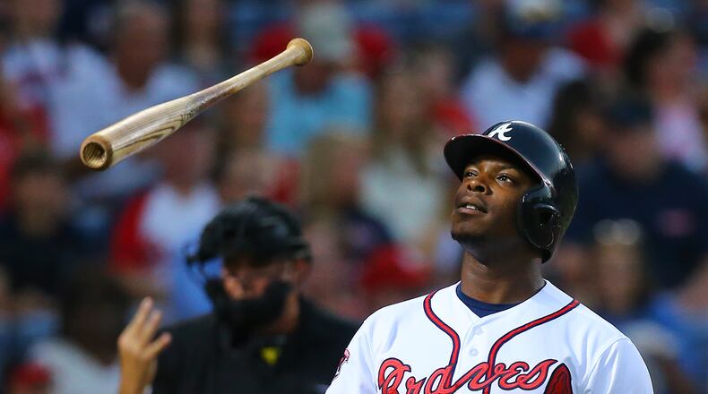 Justin Upton flips his bat in the air after umpire Tim Welke calls strike three against the Cardinals during the third inning of a MLB game on Monday, May 5, 2014, in Atlanta. CURTIS COMPTON / CCOMPTON@AJC.COM