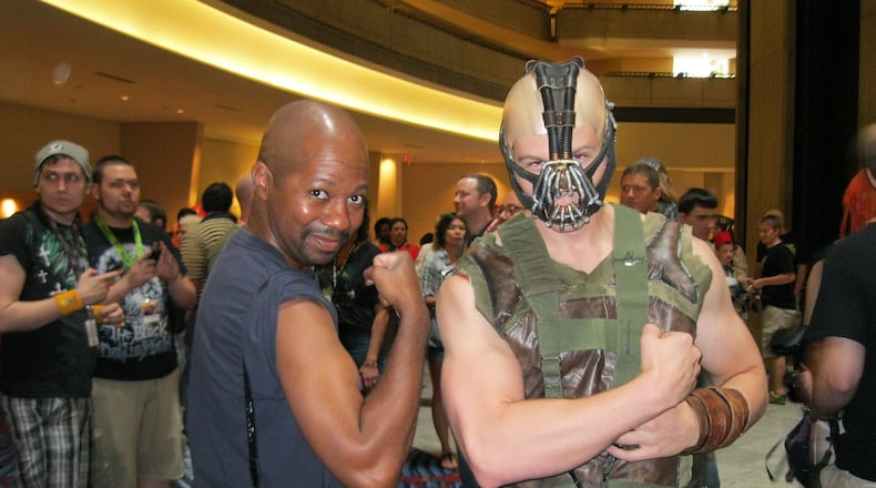 Channing Sherman (left), organizer of the Black Geeks of Dragon Con photo shoot, poses with a Bane cosplayer at Dragon Con 2012. CONTRIBUTED BY CHANNING SHERMAN