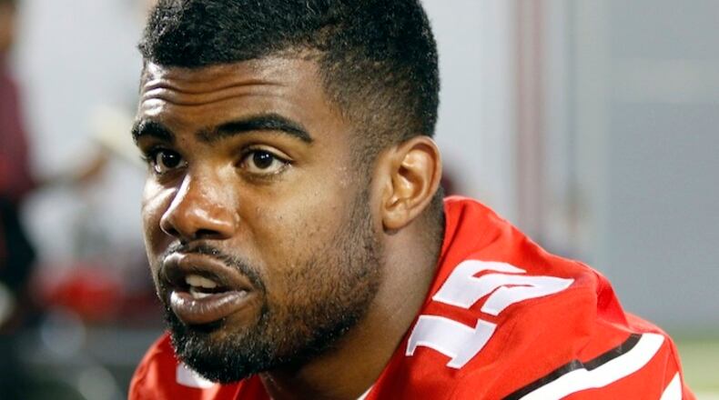 In this Aug. 16, 2015, file photo, Ohio State running back Ezekiel Elliott speaks to reporters during the university's NCAA college football media day in Columbus, Ohio. Elliott apologized for the critical comments he made about play calling after the Michigan State game and says it was the wrong time to make it known he would not be returning to school next season. Elliott posted a long apology on Twitter on Monday, Nov. 23, 2015, saying, "My intentions were not to point fingers at anyone for OUR failures." (AP Photo/Paul Vernon, File)