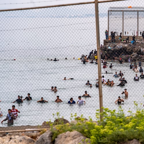 Migrants try to cross from Morocco into the Spanish enclave of Ceuta, Friday, July 31, 2026. (AP Photo/Antonio Sempere)