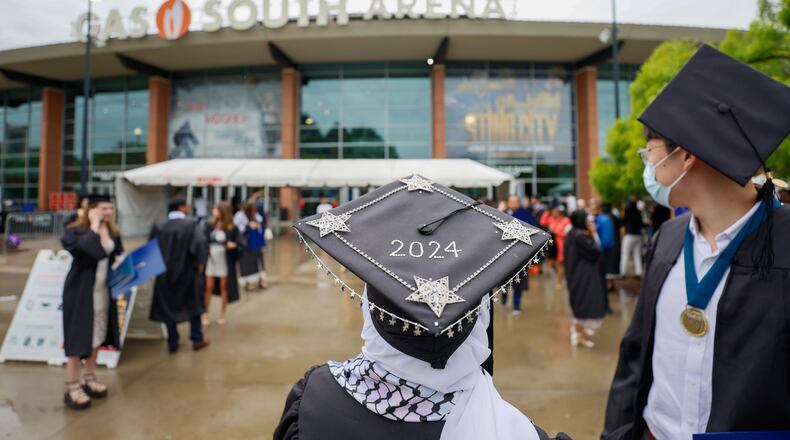 Graduates are seen leaving the Gas South Arena during Emory University's 179th Commencement ceremony at Gas South Arena on Monday, May 13, 2024, in Duluth. The school has seen many protests in support of Palestinians, and leaders pivoted to having commencement at Gas South because of safety concerns.
(Miguel Martinez / AJC)