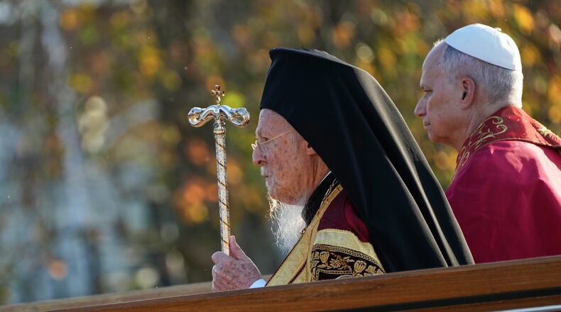 Pope Leo XIV and the Ecumenical Patriarch Bartholomew I, left, lead an Ecumenical prayer service near the archaeological excavations of the ancient Basilica of Saint Neophytos, in Iznik, Turkey, Friday, Nov. 28, 2025. (AP Photo/Domenico Stinellis)