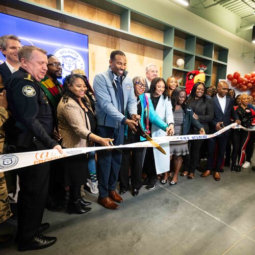 City and community leaders, including Atlanta Mayor Andre Dickens, cut the ribbon at the grand opening of the city's fourth At-Promise center Friday Jan. 23, 2026. The centers were created to give teens and young adults opportunities to get off the streets and explore other outlets and careers. (Lloyd Mackayi/Courtesy of Atlanta Police Foundation)