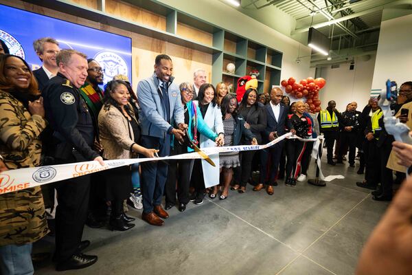 City and community leaders, including Atlanta Mayor Andre Dickens, cut the ribbon at the grand opening of the city's fourth At-Promise center.