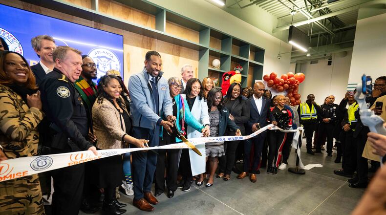 City and community leaders, including Atlanta Mayor Andre Dickens, cut the ribbon at the grand opening of the city's fourth At-Promise center Friday Jan. 23, 2026. The centers were created to give teens and young adults opportunities to get off the streets and explore other outlets and careers. (Lloyd Mackayi/Courtesy of Atlanta Police Foundation)