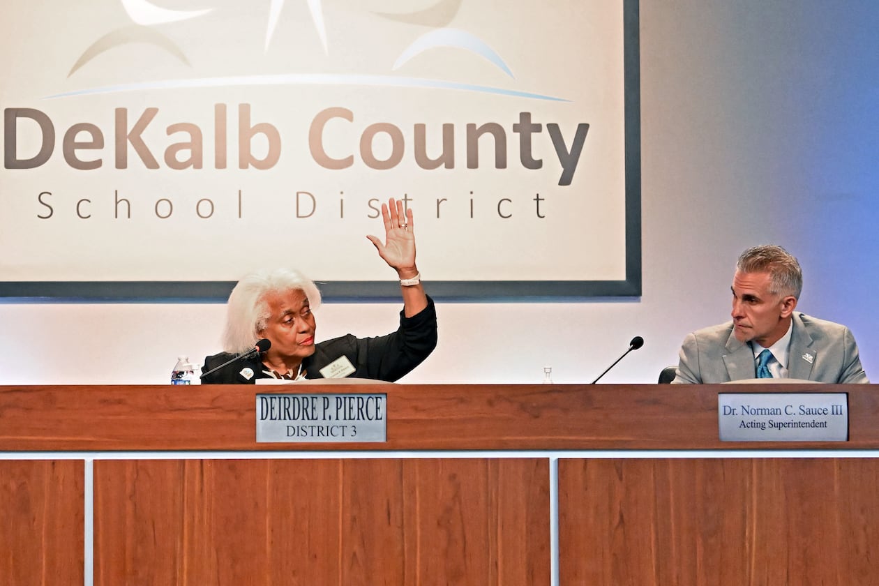 DeKalb School Board Chair Deirdre Pierce (left) and other board members vote to make Norman Sauce III acting superintendent Oct. 15, 2025. (Hyosub Shin/AJC)