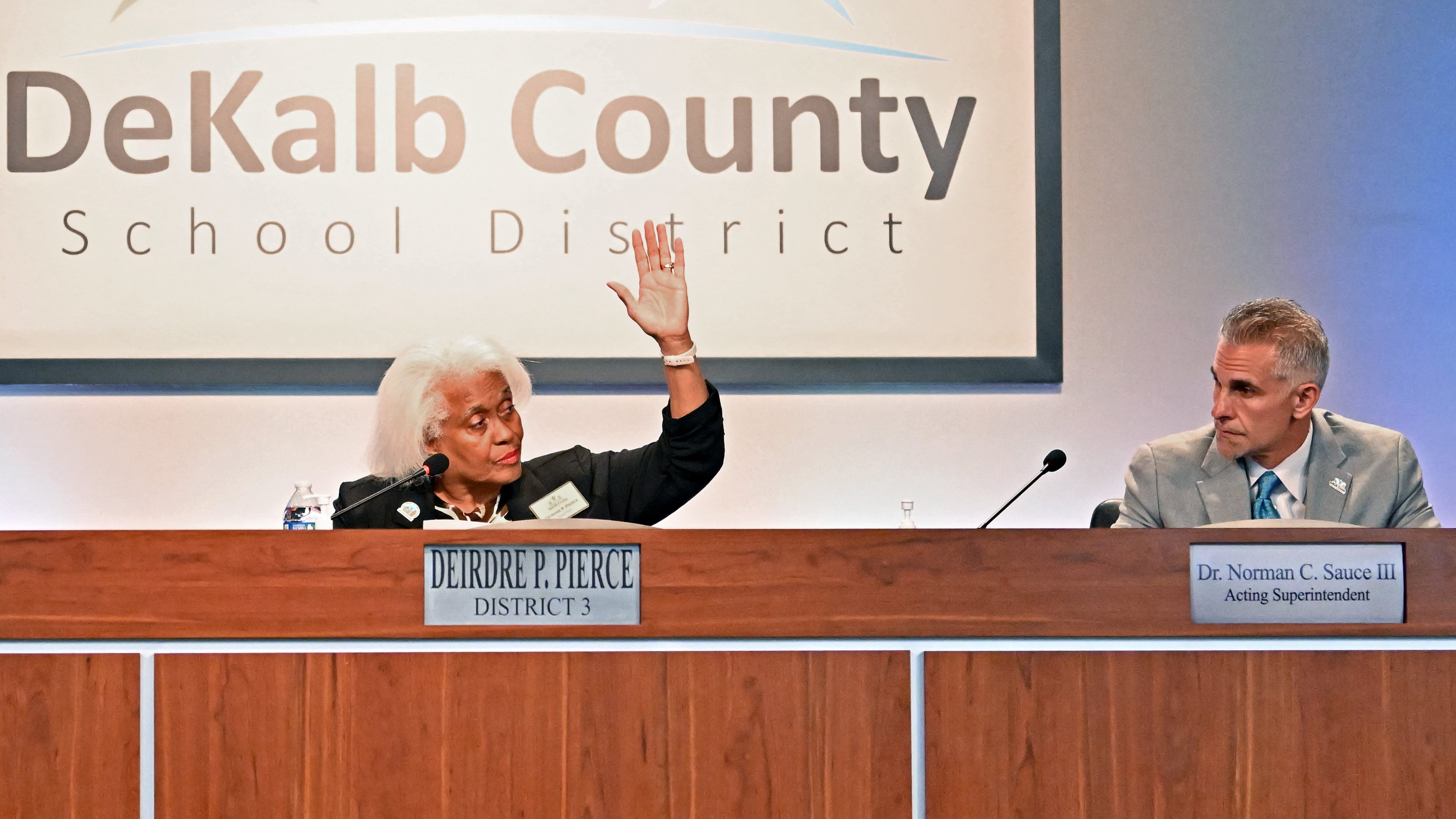 DeKalb School Board Chair Deirdre Pierce (left) and other board members vote to make Norman Sauce III acting superintendent Oct. 15, 2025. (Hyosub Shin/AJC)