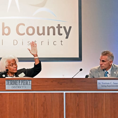 DeKalb School Board Chair Deirdre Pierce (left) and other board members vote to make Norman Sauce III acting superintendent Oct. 15, 2025. (Hyosub Shin/AJC)