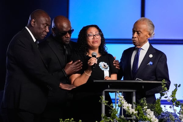Christine Wonsley (center) is flanked by her husband, Elmore (second from left), attorney Ben Crump (left) and the Rev. Al Sharpton during a memorial service Monday, July 20, 2026, for her son, Nolan Xavier Wells, who was found dead following a July 4 boat trip with friends in Mississippi. (AP Photo/Gerald Herbert)
